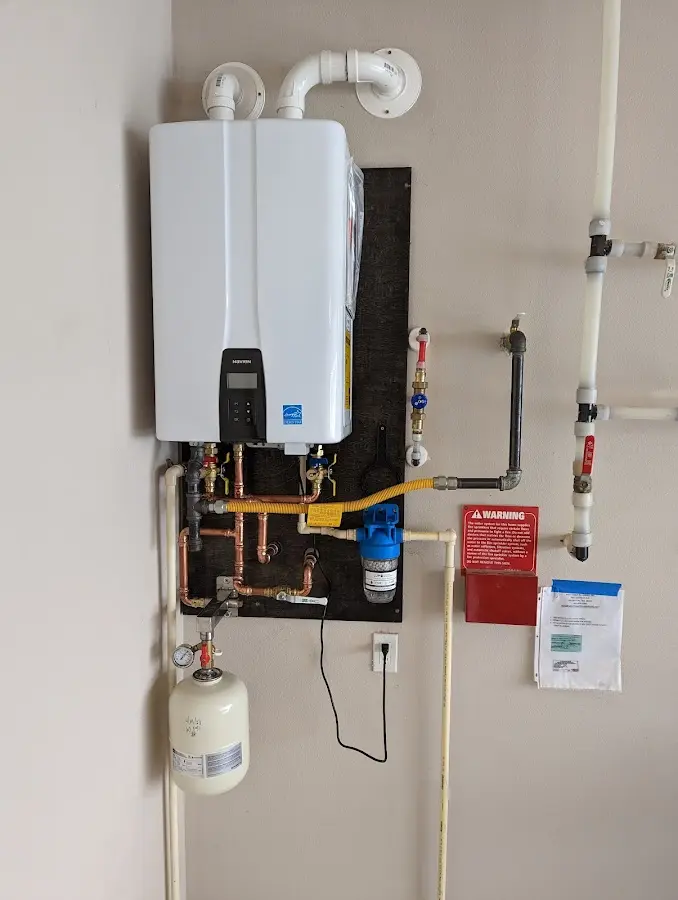 Professional plumber installing copper piping in a Mineral Wells home